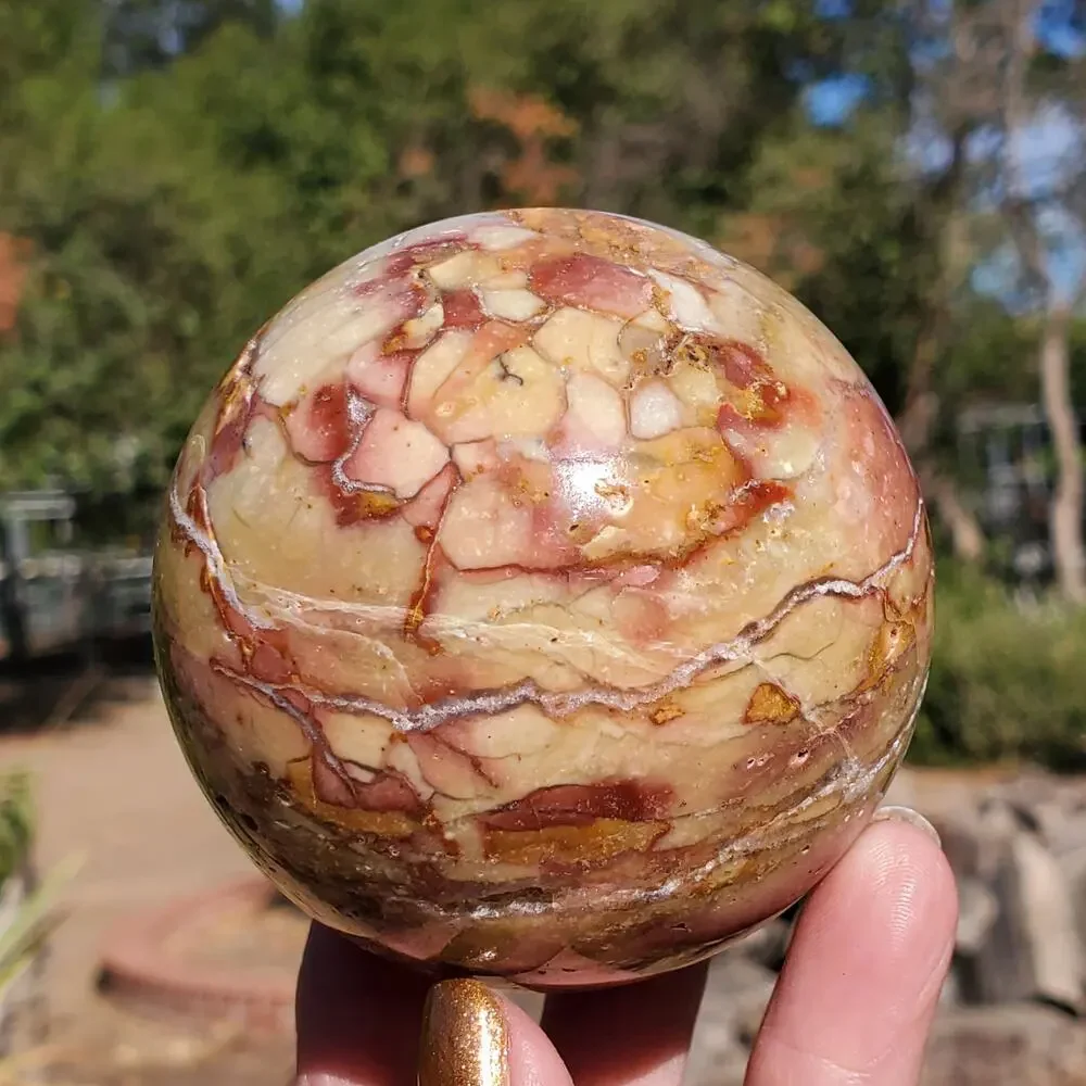 Pink Ocean Ibis Jasper Brecciated Sphere w/ Caves Druzy 458 grams 71mm